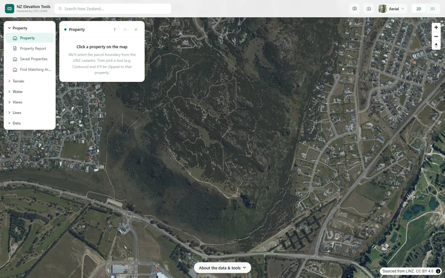 The Property tool open over Mt Iron, asking for a click on the map